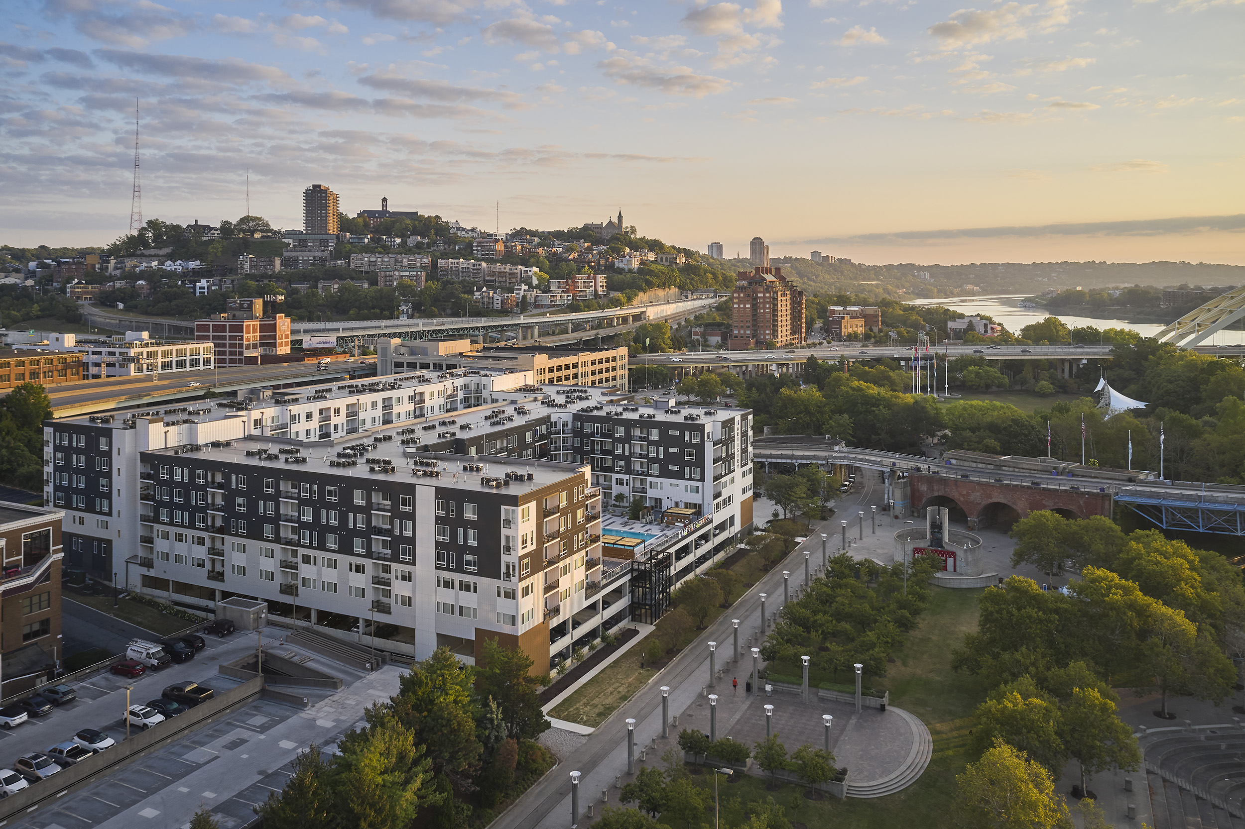 view of apartment building at sunrise over the ohio river in cincinnati